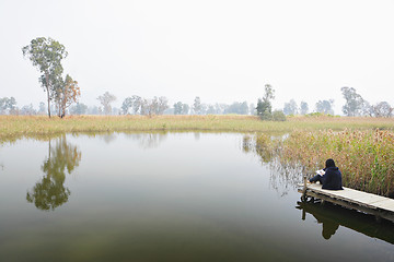 Image showing wetland with lonely girl