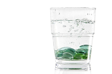 Image showing Marbles in a glass of water