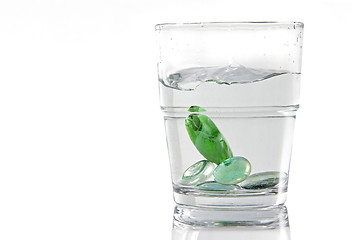 Image showing Marbles in a glass of water