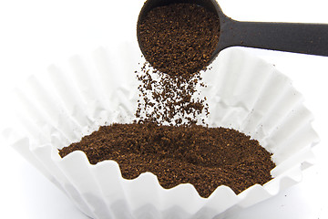 Image showing Pouring ground coffee