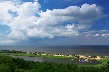 Image showing Coastline and fluffy clouds