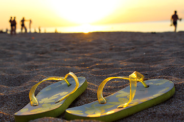 Image showing Sandals on sand