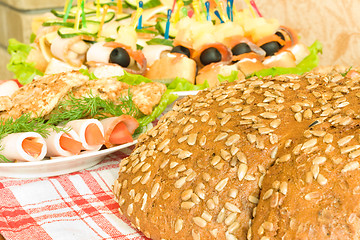 Image showing Meat, canape and Bread with seeds on table