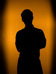 Image showing Back lit silhouette of man 