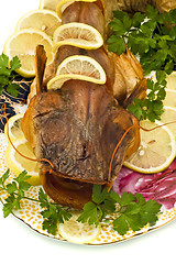 Image showing Shore dinner - smoke-dried sheatfish with lemon