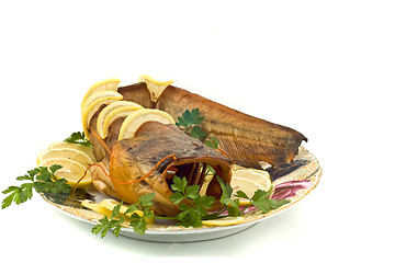 Image showing Shore dinner - bloated catfish (sheatfish) with lemon