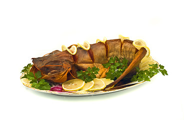 Image showing Dinner - bloated fresh-water sheatfish with lemon