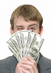 Image showing Happy winking businessman holding money