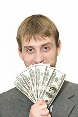 Image showing Smiling Businessman with hundreds of dollars