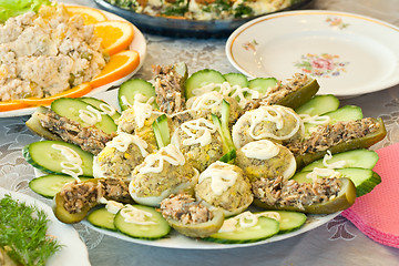 Image showing Stuffed eggs and cucumbers. Banquet in the restaurant