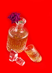 Image showing Crystal decanter with jigger for alcoholic beverage and flower