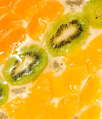 Image showing Sliced kiwi, orange and mandarin segments