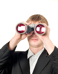 Image showing Businessman with binoculars searching for something