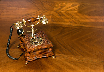 Image showing Old-fashioned telephone on table