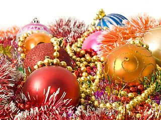 Image showing Christmas colorful decoration - baubles, tinsel and beads