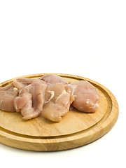 Image showing Close-up of raw Chicken fillet on hardboard