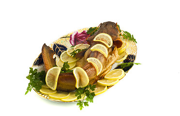 Image showing Food - bloated fresh-water catfish (sheatfish) with lemon