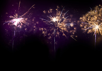 Image showing Colorful Bright fireworks at night in the black sky