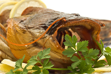 Image showing Shore dinner - Bloated sheatfish with lemon and parsley