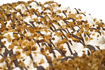 Image showing Close-up of birthday cake with cream, nuts