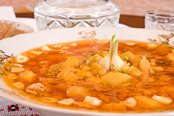 Image showing Plate with Borsch and jigger of vodka