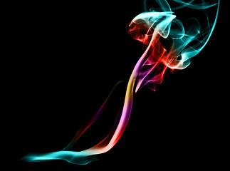 Image showing Colorful magic abstract fume curves over black