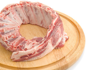 Image showing Uncooked Pork ribs on round hardboard