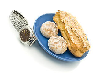 Image showing Lunch time - Watch and delicious pastry