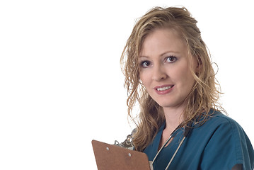 Image showing Attractive nurse holding clipboard