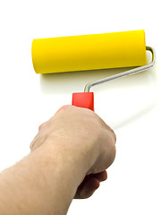 Image showing Yellow Roller for renovation in hand