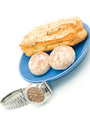 Image showing Lunch time - Watch and delicious pastry