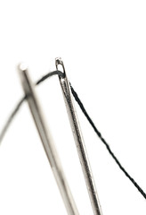 Image showing Two needles with thread over white