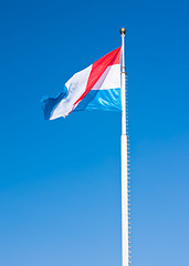 Image showing Flag of Luxembourg over blue sky