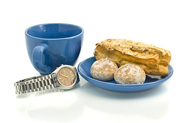 Image showing Lunch time - Watch, blue cup, pastry