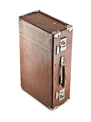 Image showing Traveling - aged suitcase isolated 