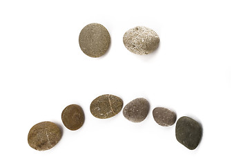 Image showing Negative sad emoticon assembled of pebble