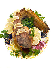 Image showing Bloated fresh-water catfish with lemon and parsley