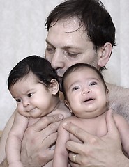 Image showing father and baby twins