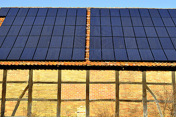 Image showing Solar panels on a roof of a rural shed in Germany