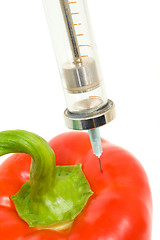 Image showing GMO - pepper with sticked aged syringe 