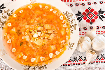 Image showing In the restaurant - borsch and garlic heads