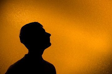 Image showing Look ahead - Back lit silhouette of man