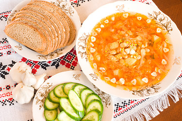 Image showing Borsch, black bread and sliced cucumber