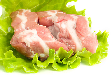 Image showing Pork meat on green salad. Isolated