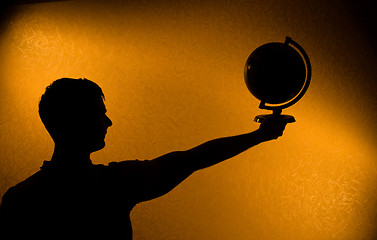 Image showing World in your hands - silhouette of man