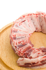 Image showing Raw Pork ribs with meat on round hardboard