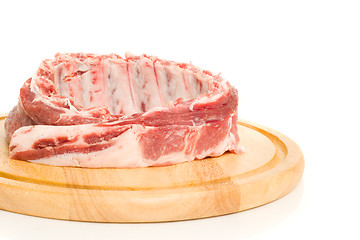 Image showing Tasty Pork ribs on round hardboard