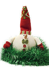 Image showing Plush Christmas snowman toy in green tinsel