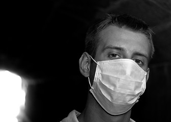 Image showing Man with gauze bandage in dark tunnel