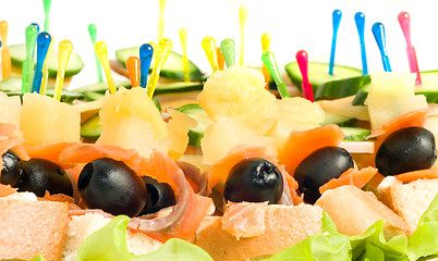 Image showing Close-up of canape with olives, cheese and mushrooms